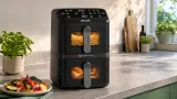 Zwei Gerichte, wenig Stellfläche: Philips NA460/00 bringt die Doppelkorb-Idee ins Hochformat